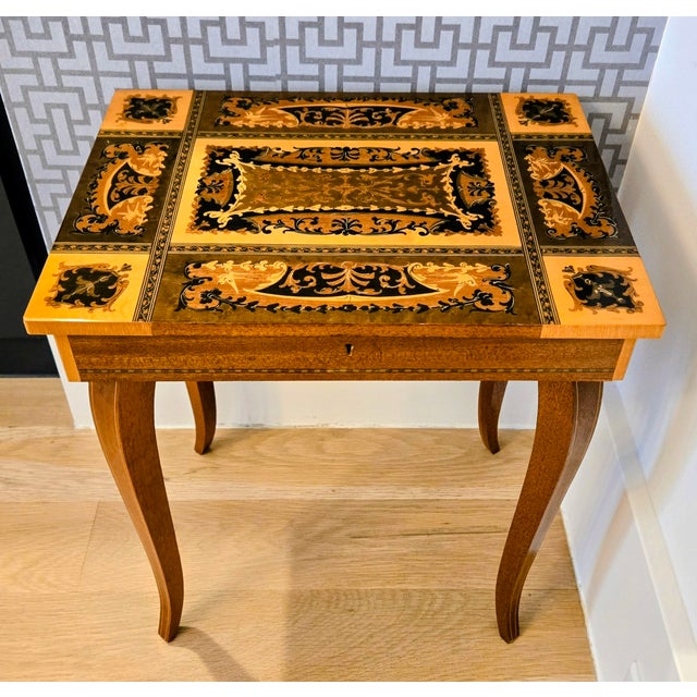 Charming vintage Italian marquetry side table with a built‑in Reuge Swiss music box, likely crafted in Sorrento and...