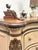 Beautifully refinished six-drawer dresser with warm ash burl detailing, a rich wood top, and ornate brass hardware. Soft...