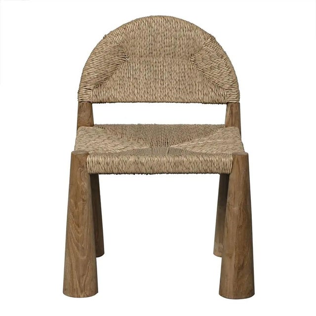 Crafted from high-quality teak and featuring a synthetic woven seat, this chair exudes elegance and resilience. The clear...