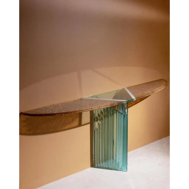 This beautiful luigi massoni console table appears as if floating in the air. It is actually supported by a glass detail,...