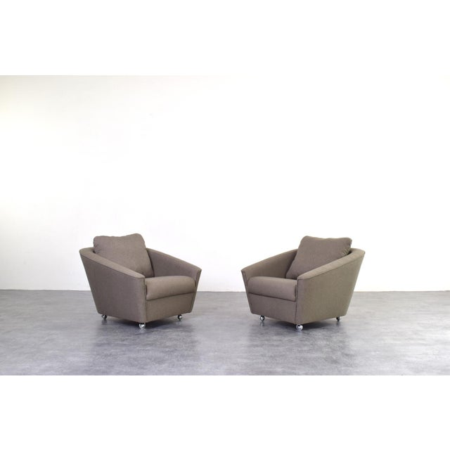 This set of two Space-Age club armchairs was manufactured in Germany in the 1960s. The lounge chair have been...