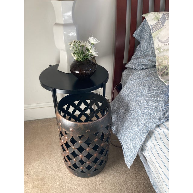 This is a sturdy metal multi functional piece with a trellis design and an antiques black/bronze finish. Use it in your...