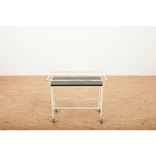 Tea Serving Trolley with White Lacquered Tubular Steel Frame and Black Lacquered Wooden Board, in Worn conditions....