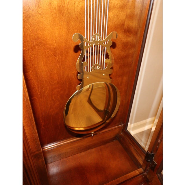 A finely crafted vintage longcase clock by Ridgeway, presented in a warm cherry finish with classic architectural lines....