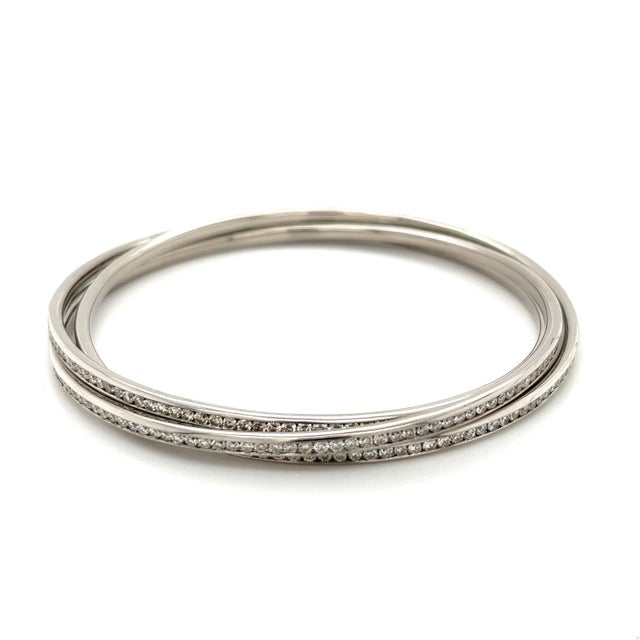 3 piece, "3-ring" bangle bracelet set with over 7 carats in shiny diamonds welded in unison to create a gorgeous and...