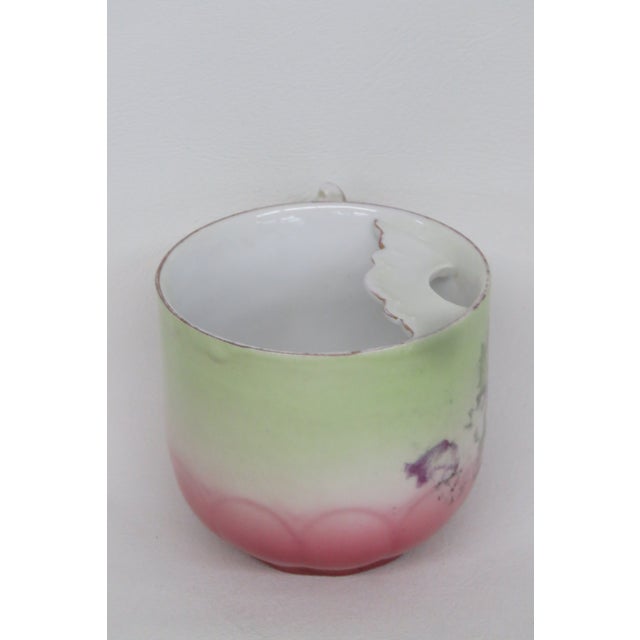 This gorgeous Mustache Mug is made of porcelain. This piece is stamped as being made by PM Bavarian. This lovely mug has a...