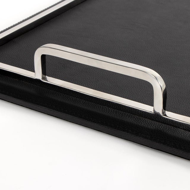 Available with brass or nickel accents, the Greyson Rectangle Trays are crafted from smooth, structured leather for a...