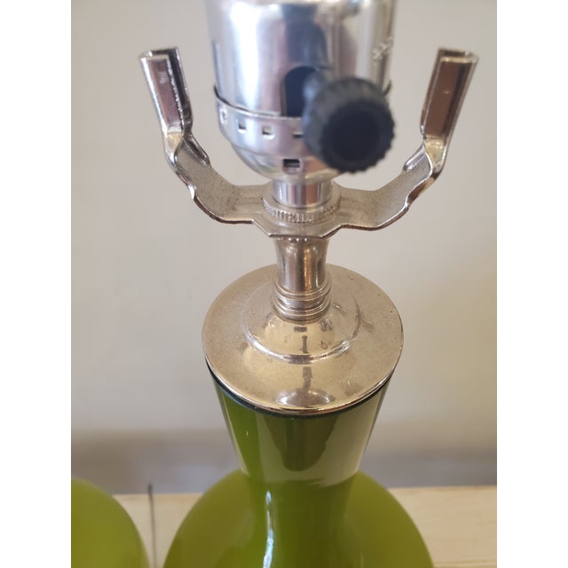 Green glass table lamp, clear Lucite base, clear cord, takes 3 way bulb. Works perfectly.