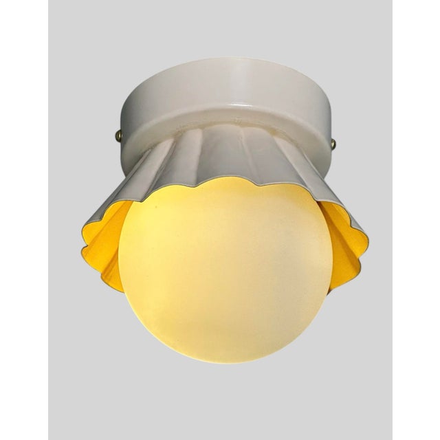 Illuminate your space with style using this charming small flush mount lamp featuring a sleek design and a milk glass...