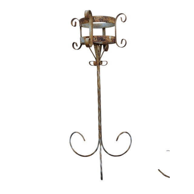 Wonderful pair of Mid Century scrolled and twisted iron plant stands (pair). Sturdy and has some weight to them. Great,...