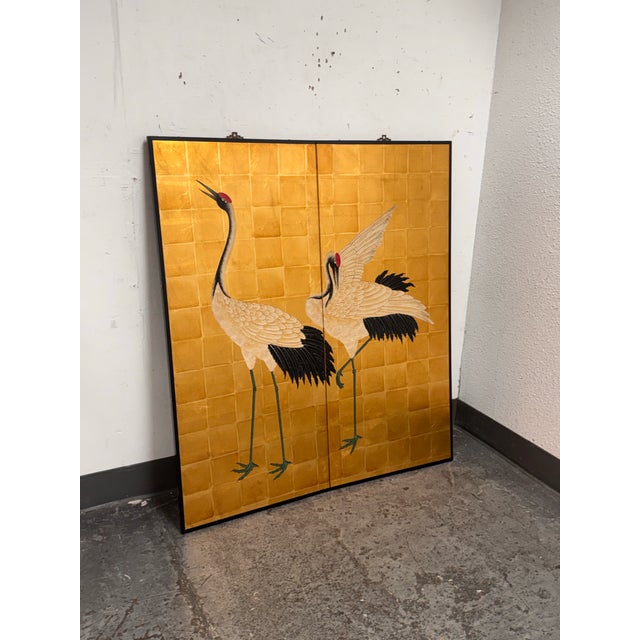 Design Plus Gallery presents a Vintage Two Panel Crane Motif Screen. A gold tone background and black border. The artwork...