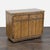 Produced in the 1970s, this piece features warm fruitwood and campaign-inspired brass accents. Two concealed flip-top...
