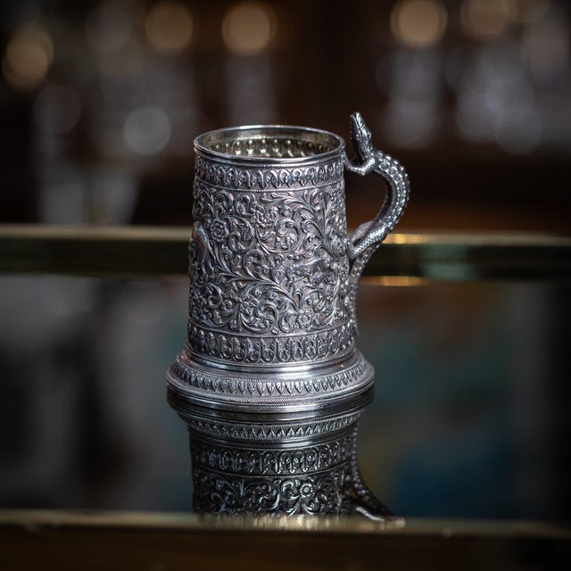 Antique 19th century indian kutch (cutch) solid silver mug. Of tapering cylindrical form, finely worked in repoussé and...