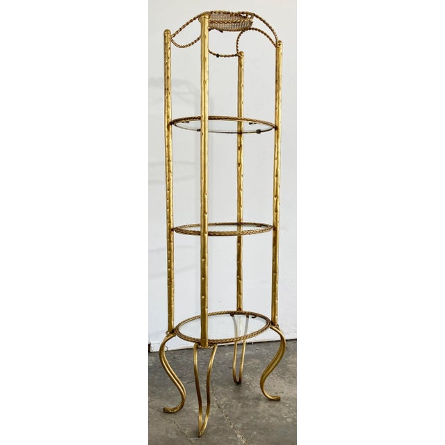 Vintage Italian 3-tier brass and glass etagere framed in rope twist design and raised on elegant sturdy legs. Distance...