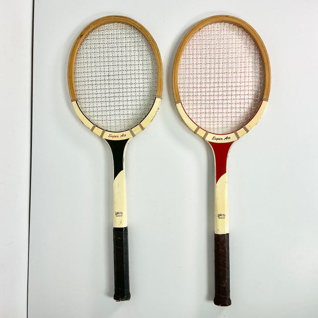 This is a set of Vintage Wood Tennis Rackets are from the 1960s. They are a set of two matching rackets under the Super...