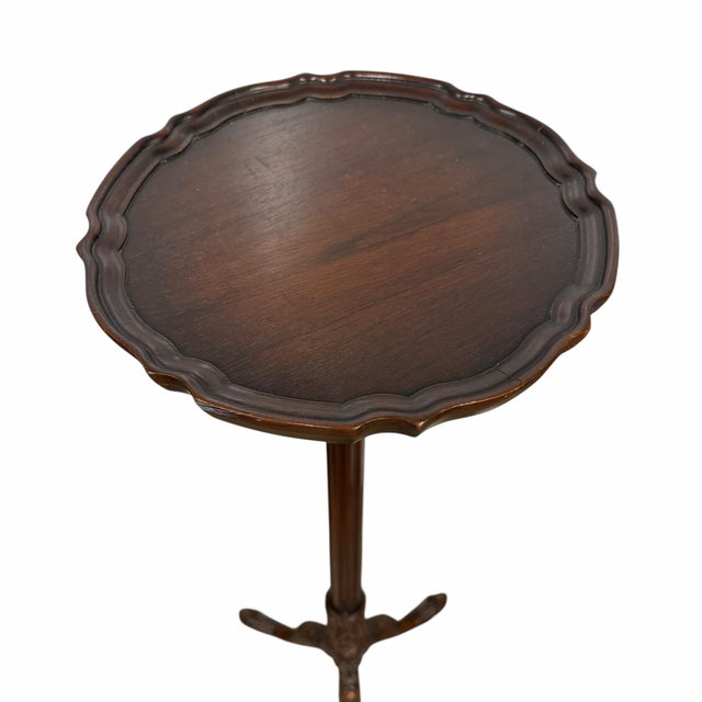 Vintage carved wood pie crust pedestal plant stand. Sits on three carved claw feet. Finish is in dark brown. Dome very...