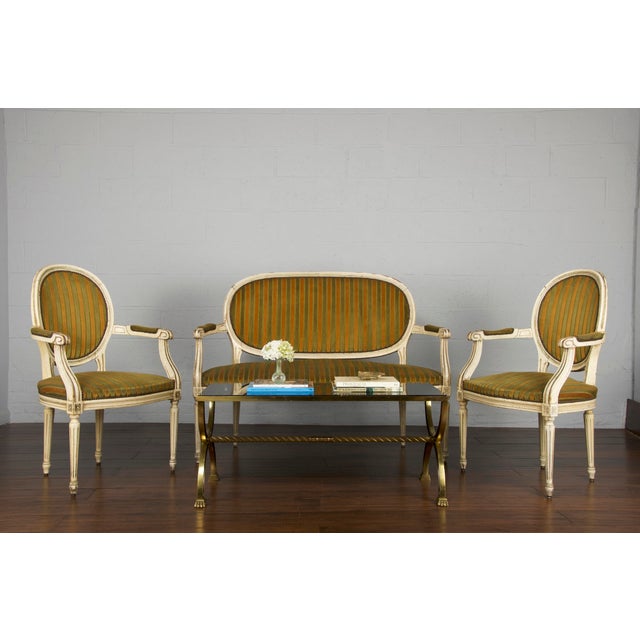 Gorgeous, French provincial Louis XVI style painted loveseat with two armchairs set from Provence, France. The set...