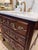 This 19th century French chest of drawers with ornate brass pulls feels fresh and functional again with addition of...