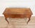 A finely made Provençal console table in solid walnut, crafted in the Louis XV style during the 20th century. The piece is...