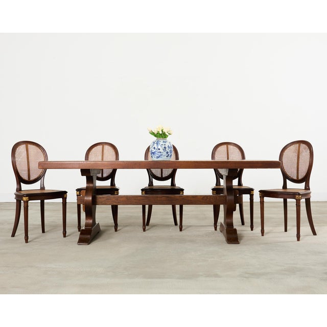 Handsome 20th century country French provincial style farmhouse dining table crafted from oak. The table features a...