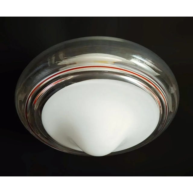 Vintage Italian flush mount or wall light with a single Murano glass shade hand blown with milky white center, clear body...