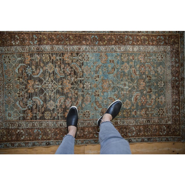 :: Allover covered field in a Herati design motif with heavy abrashes across. Wrapped by a main border of multi-blossomed...