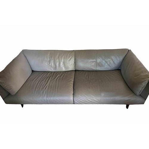 Vintage John John Leather three seats sofa and Coffee Table is a design item realized by Jean Marie Massaud for Poltrona...