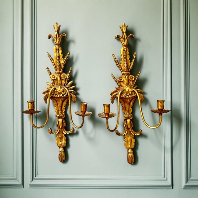 Bring timeless European elegance to your interior with this impressive pair of vintage Louis XVI-style gilt wall candle...