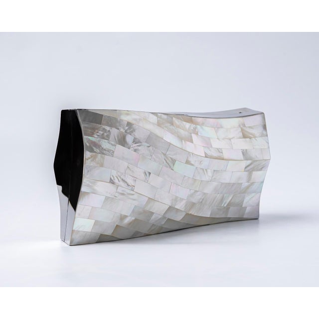 Inspired by Bilbao’s most iconic architecture, the BILBAO Curved Minaudière is a striking fusion of art and design. Its...