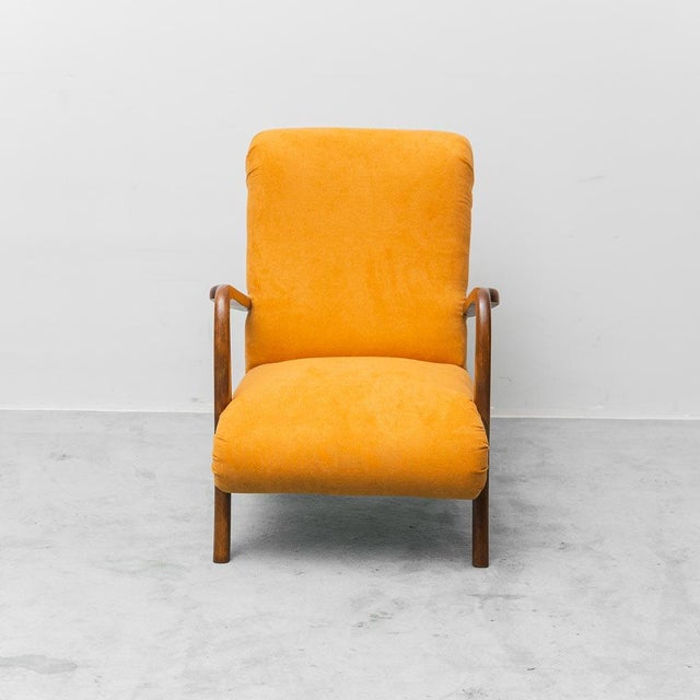 Armchair in light orange fabric with a wooden frame. Item in excellent condition. See photos.