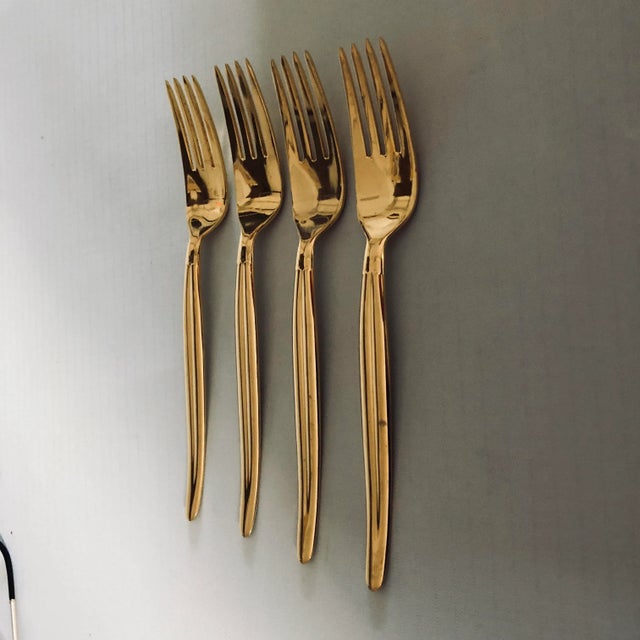 90's Gold stainless set of 4 salad or dessert forks 6.25"L , Makers mark reads " Present By Austria Vienna Stainless" They...