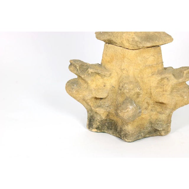 A weathered carved limestone architectural element, originally a spire from a church in Winchcombe, Gloucestershire, UK...