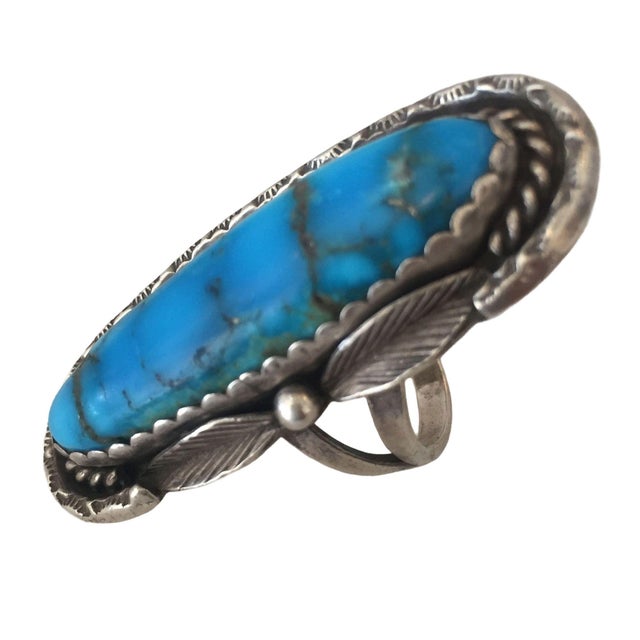 Vintage Southwest style bell trading post ring with a sterling silver band and a large turquoise stone. Ring size 10.