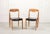 Authentic Scandinavian set of four black leatherette dining chairs in the style of early edition model 71, after N.O....