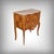 This marquetry commode elegantly embodies the spirit of the transition style, a period when the sensual curves of louis xv...