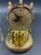Late 19th century small German clock with glass dome. The ball weights circle (turn) back and forth. Requires one AA...