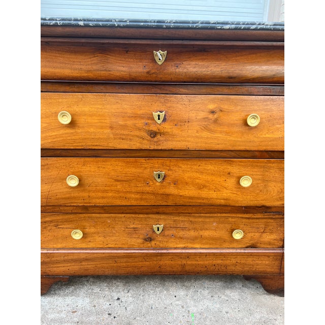 French 19th Century Louis Philippe Walnut Commode featuring a warm, richly grained walnut case with four graduated...