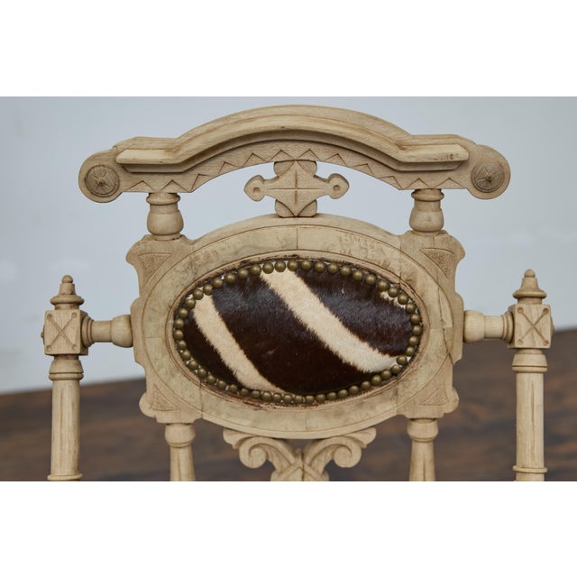 This English Aesthetic Movement accent chair from the 1880s is a stunning example of craftsmanship and decorative detail....