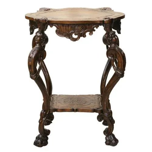 Carved wooden table in the neo-Roccoco style of the turn of the 19th century, on curved legs with paws and half-figures of...