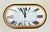 Cartier Paris “Accordion” Desk Clock with Date, Burgundy Enamel and Roman Numeral Dial, circa 1980. A distinctive and...