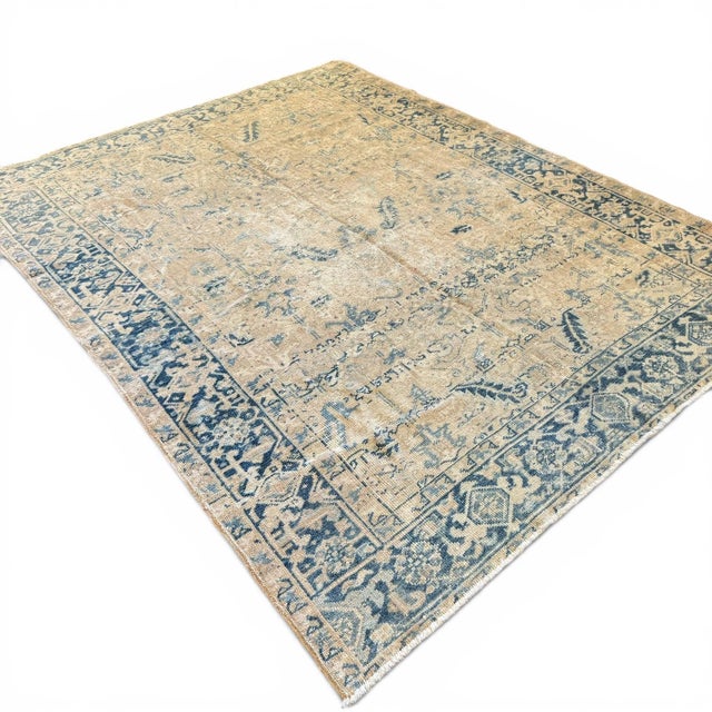 A timeless and beautifully aged antique Heriz rug, approximately 110 years old, showcasing the the traditional geometry...
