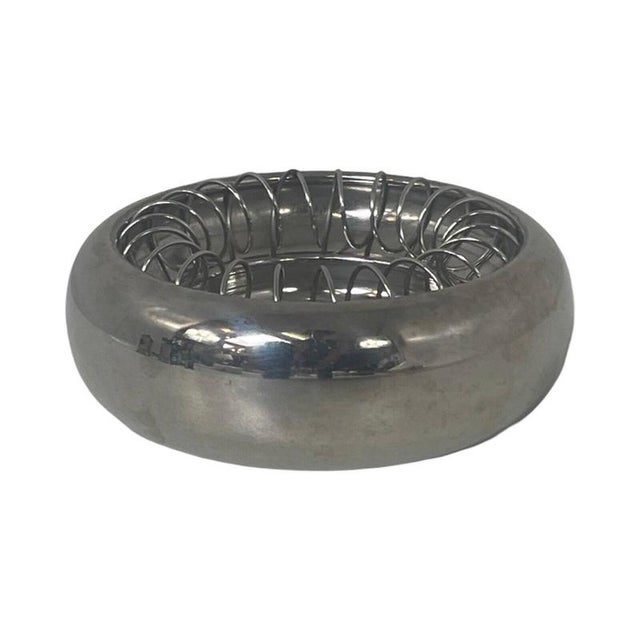 Round shaped bowl with a sprial inside that can be taken out. It can be used as an ashtray or just as a small bowl. Made...