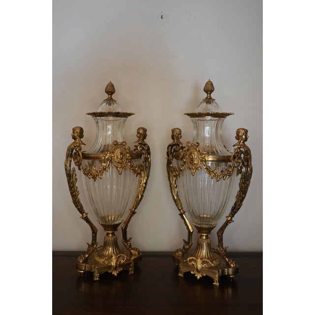 Antique Signed French Gilt Bronze Mounted Diamond Cut Baccarat Crystal Urns - Pair This pair of beautiful urns feature...