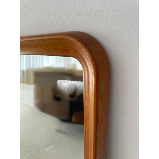 Classic Danish mid-century modern teak mirror with rounded corners.