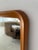 Classic Danish mid-century modern teak mirror with rounded corners.