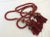 Beautiful antique red cord double tassel. This is beautifully worn, has intricate details and exposed areas where silk...