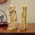 A pair of handcrafted resin figurines produced by Action-Lobeco in Italy during the late twentieth century. Each figure is...