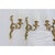 An exceptional grouping of four early 20th century Louis XV-style wall sconces, made of gilt bronze sculpted into the most...
