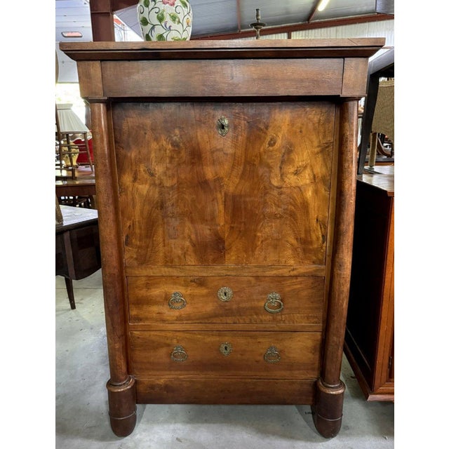 Empire period walnut secretary desk Front opening with three drawers and a drop-front Very beautiful interior with a green...