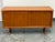 Design Plus Gallery presents a Circa 1985 Danish Teak Credenza from Dyrlund. This vintage piece showcases a long...